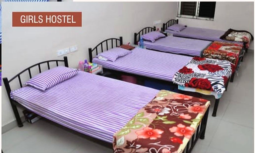 Neat beds inside the Adyant girls hostel room